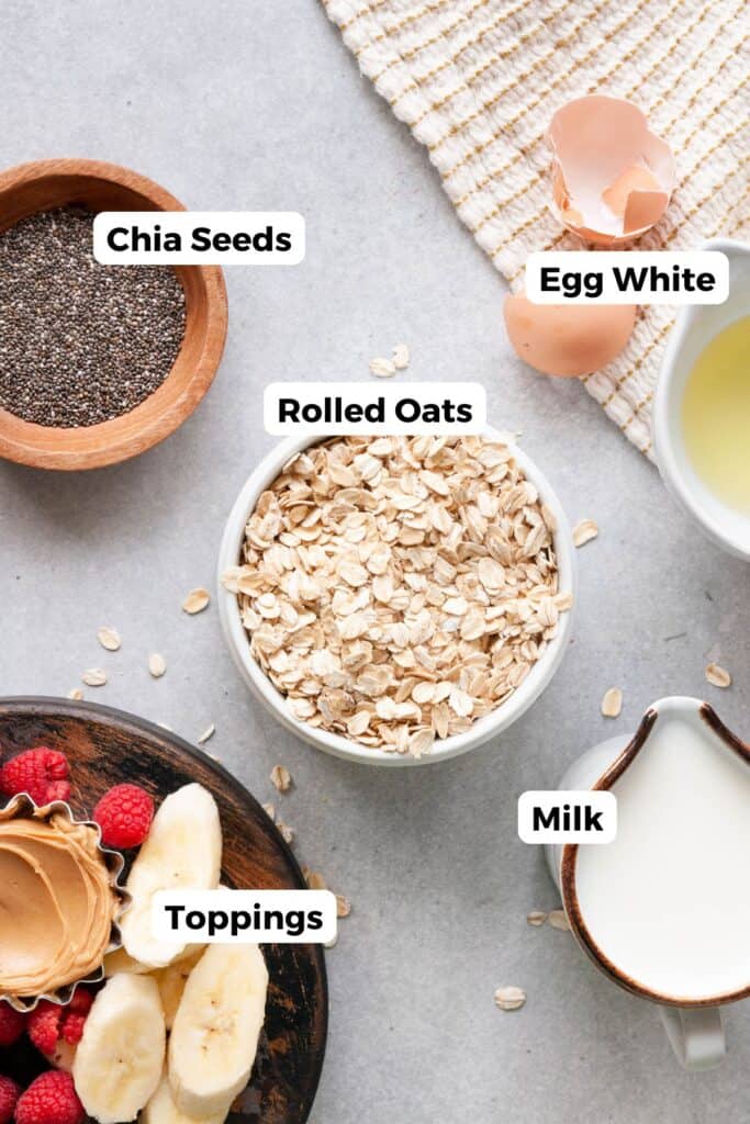 all ingredients in egg white oatmeal including oats, milk, chia seeds, egg whites, and toppings