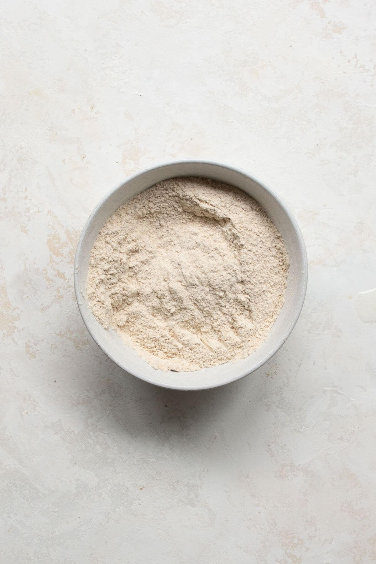 Whole wheat flour, salt, and baking soda in a mixing bowl.