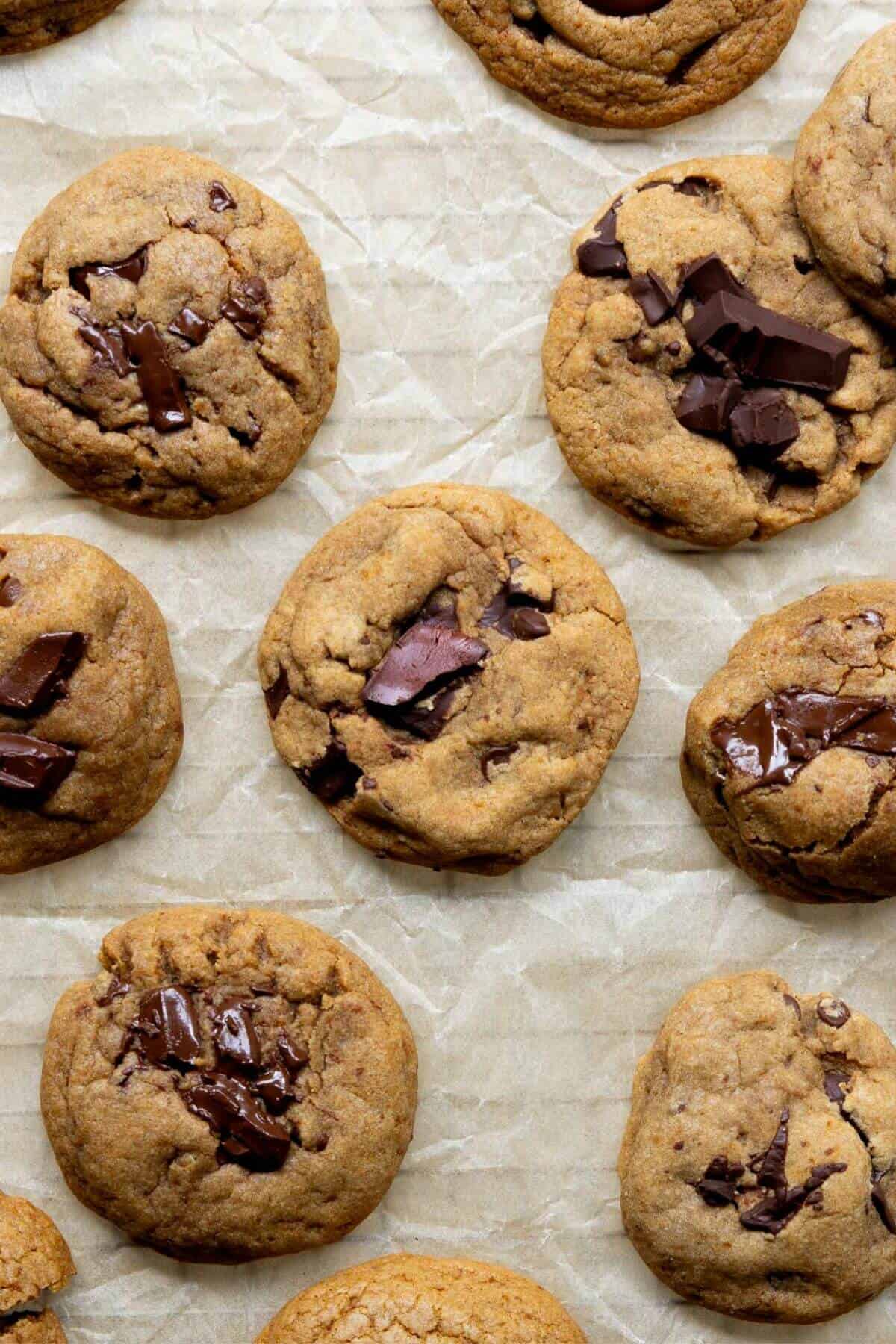 Healthy chocolate chip cookies with soft and gooey centers on a wire rack cooling down.
