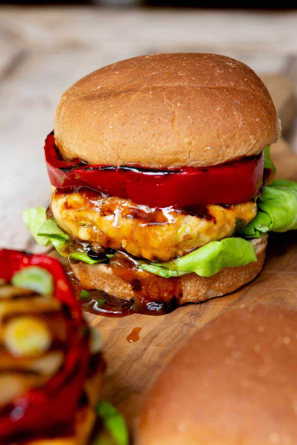 Healthy teriyaki chicken burgers served with caramelized pineapple and bell pepper rings.