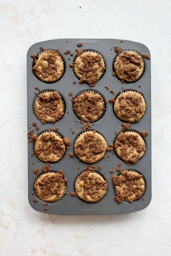 baked healthy apple crumble muffins in cupcake tin