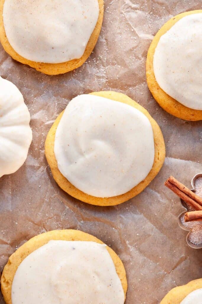 Soft, pillowy Lofthouse-style  gluten-free pumpkin cookies topped with a lightened-up cream cheese frosting.