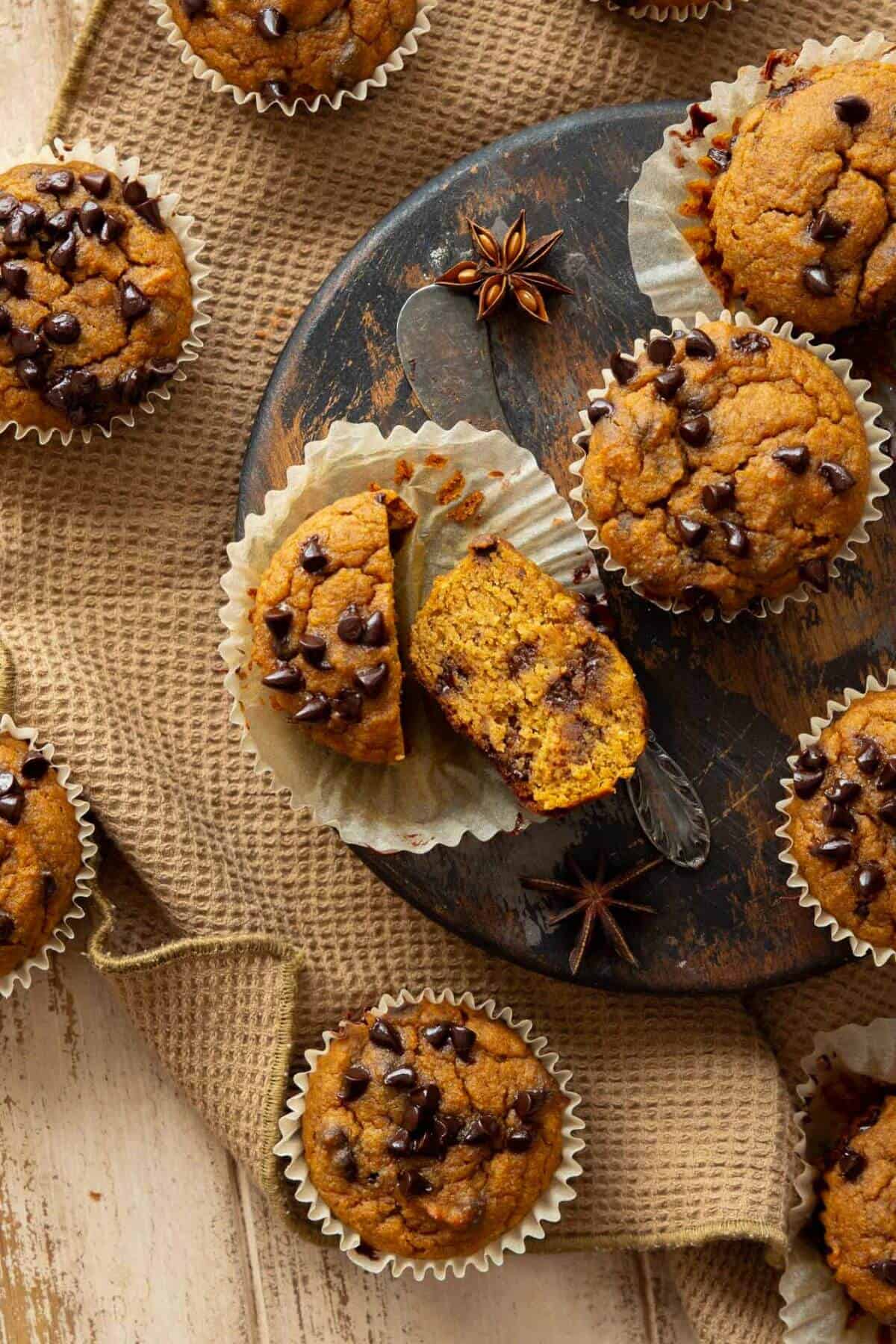 Healthy chocolate chip pumpkin protein muffins with super fluffy, moist center.