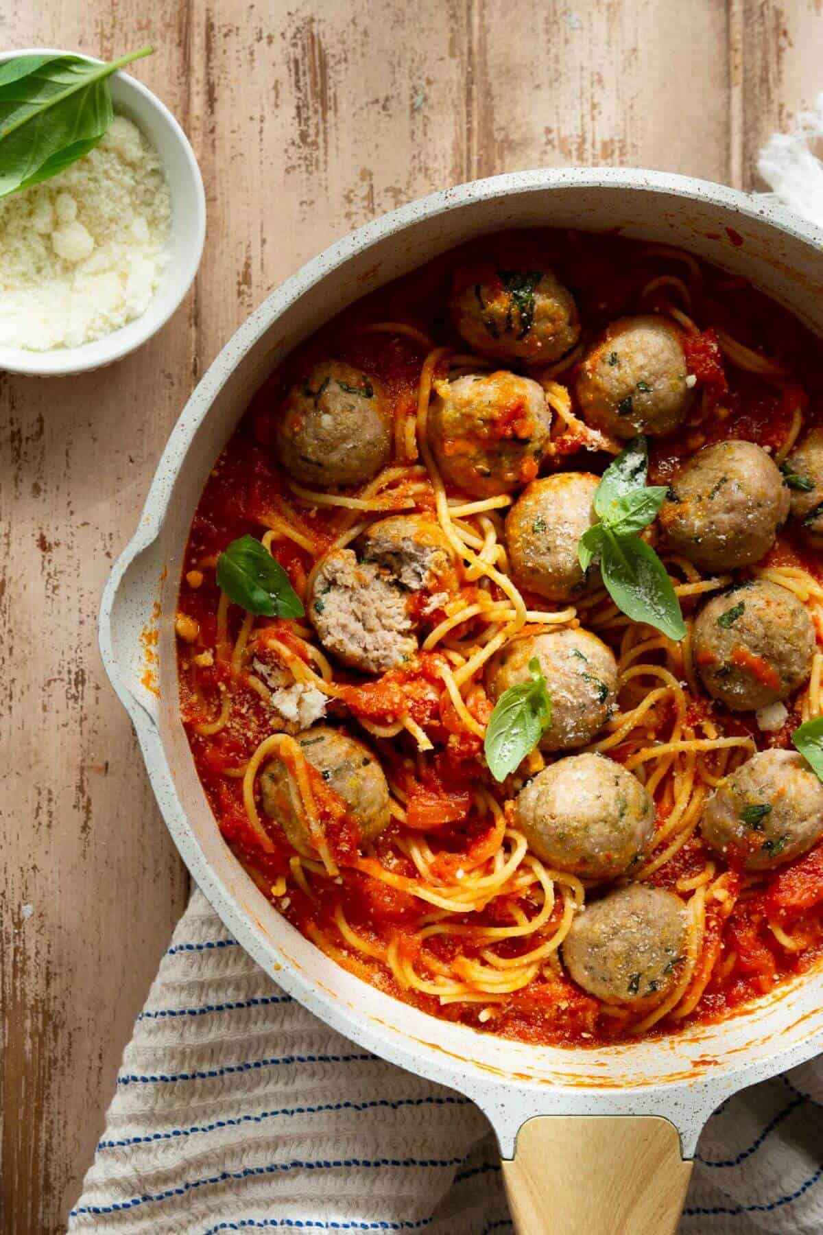 Healthy air fryer turkey meatballs with pasta and sauce.