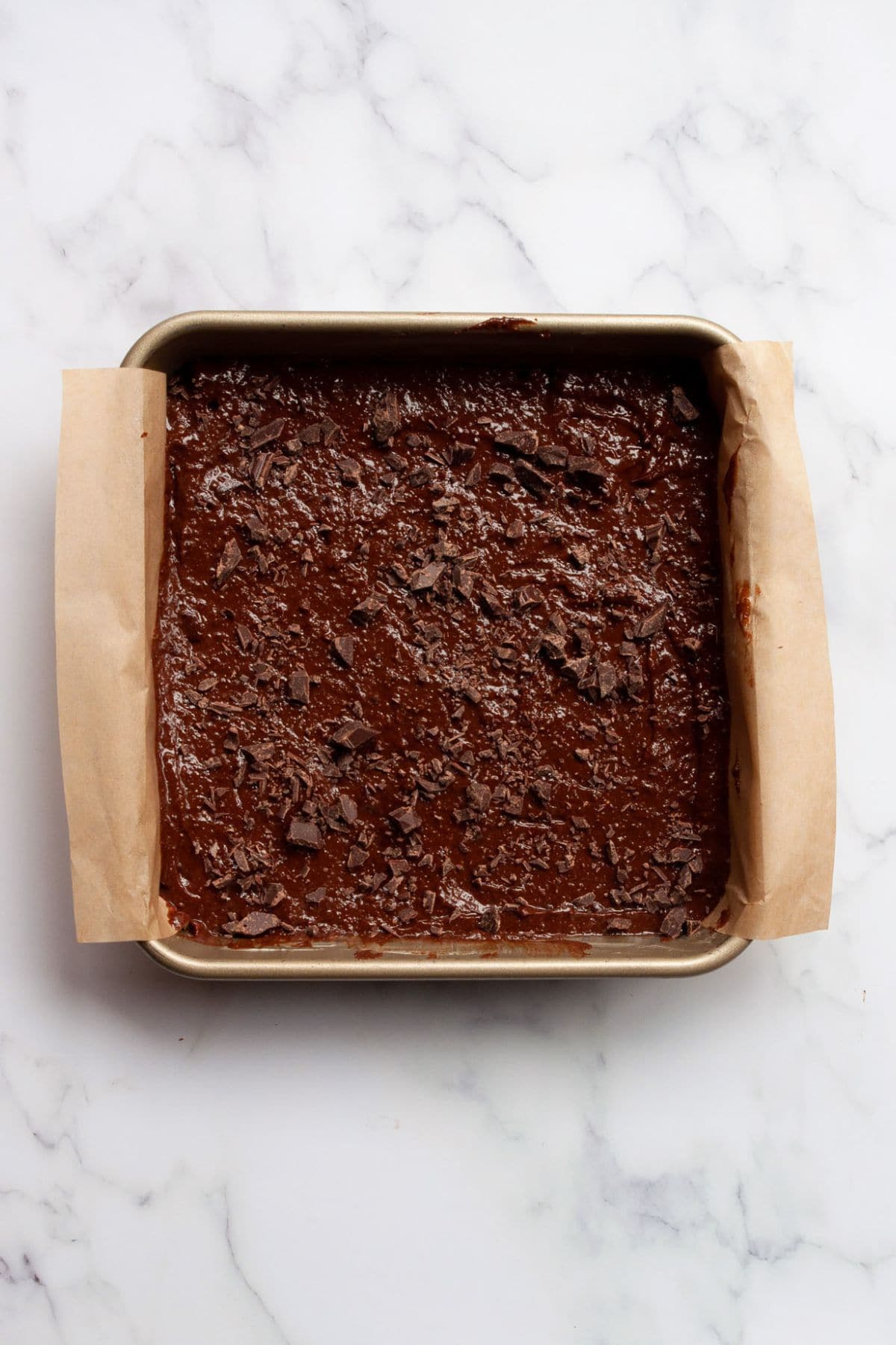 Flourless brownie batter in baking dish before baking.