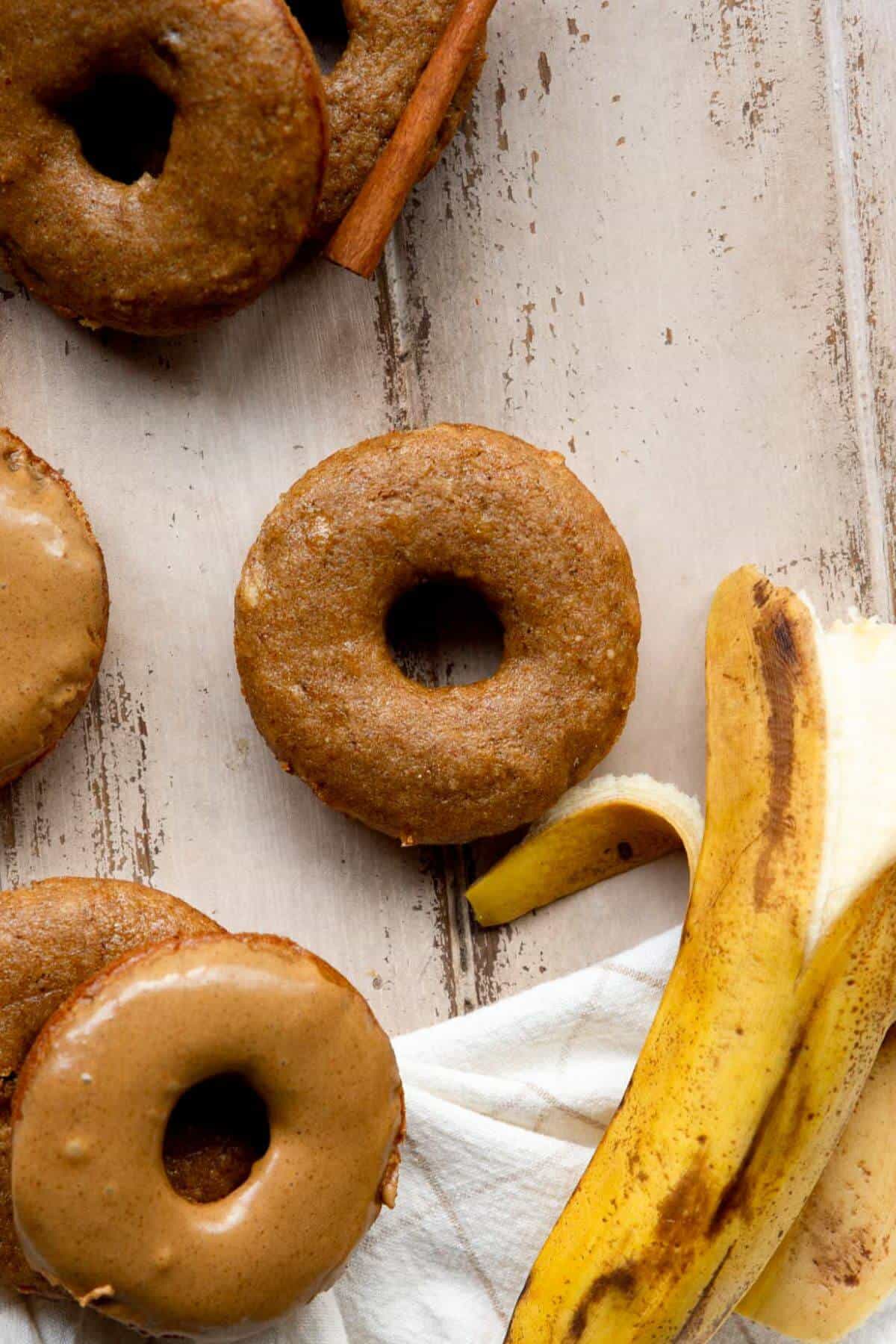Freshly baked banana donut without glaze, showing soft and cakey texture.