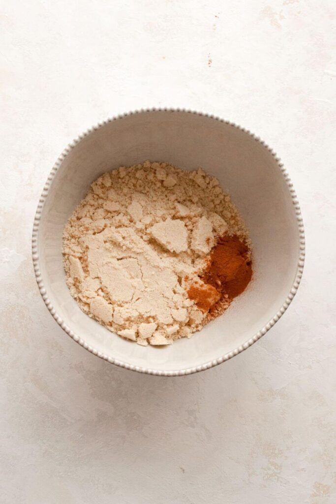 almond flour, oat flour, cinnamon, baking soda, salt, and baking powder in a mixing bowl