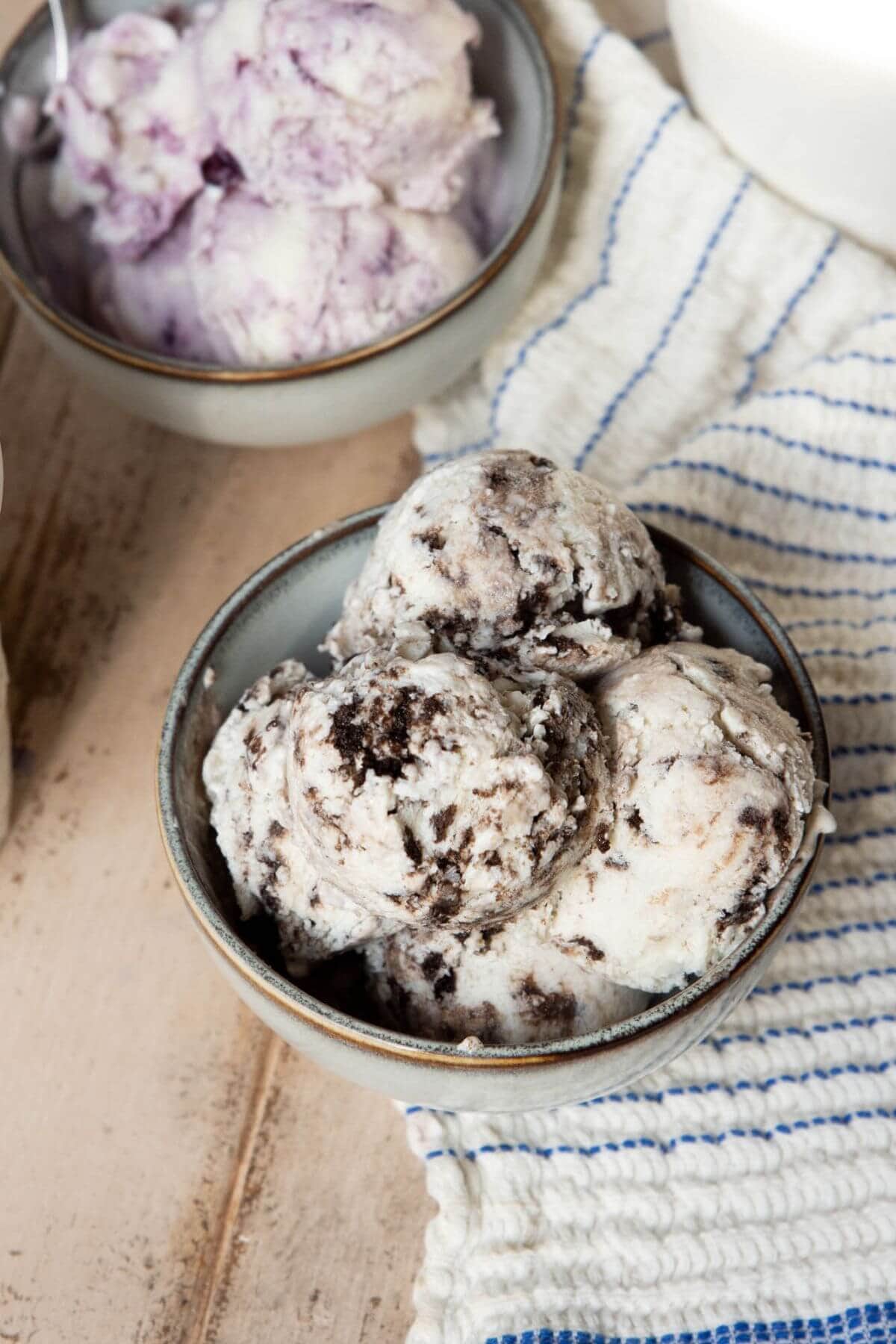 Creamy cookies and cream protein cottage cheese ice cream scooped into a bowl.