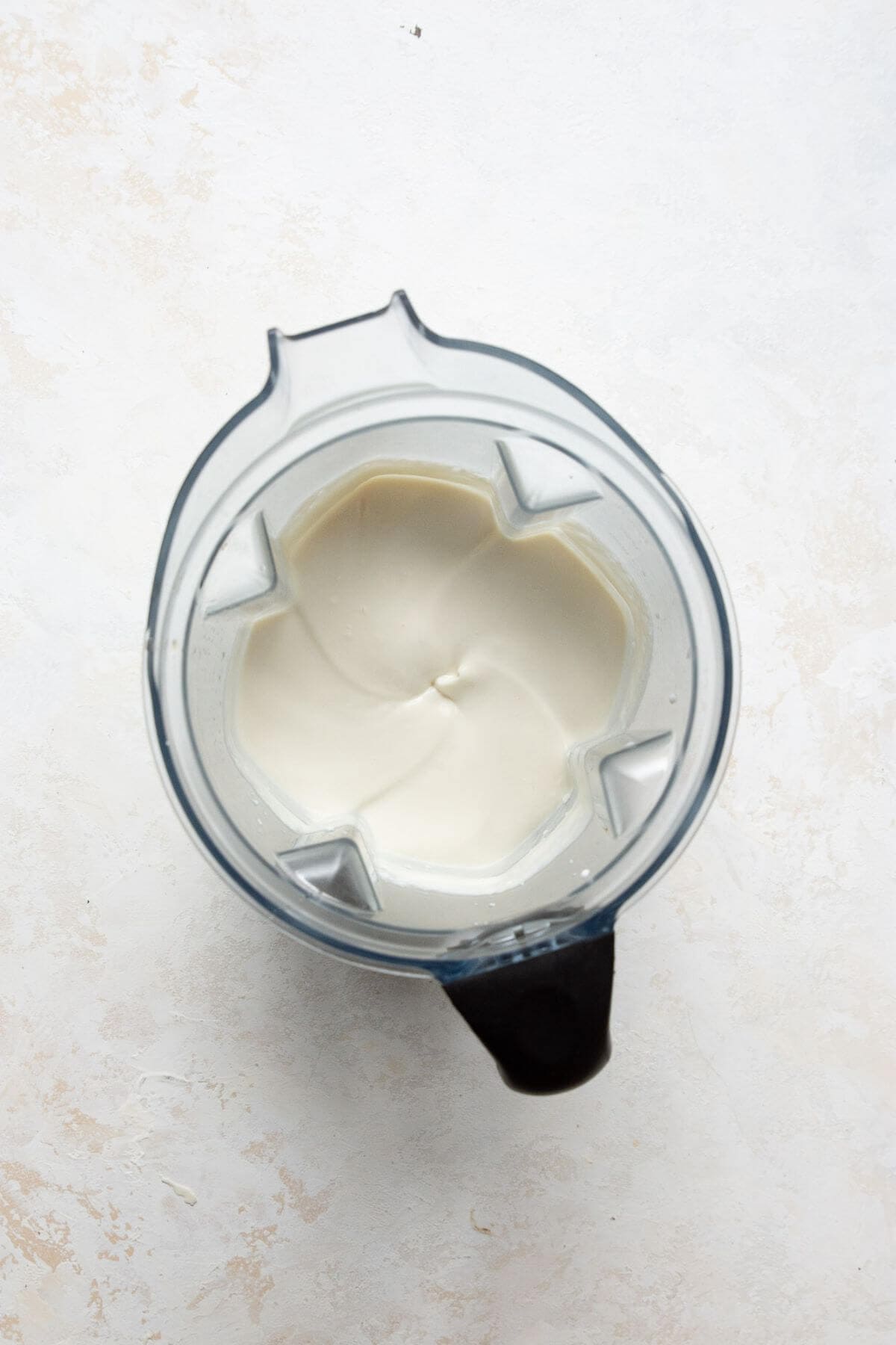 Smooth cottage cheese ice cream base in a blender.