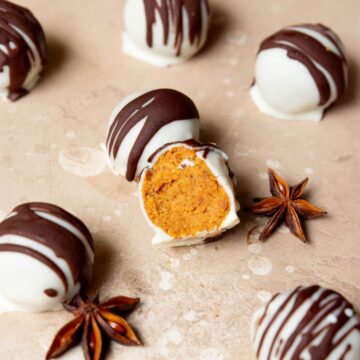 pumpkin spice truffles with white chocolate shell and dark chocolate dizzle