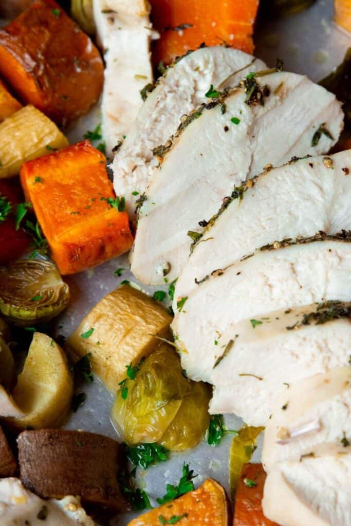 juicy sheet pan chicken sliced up