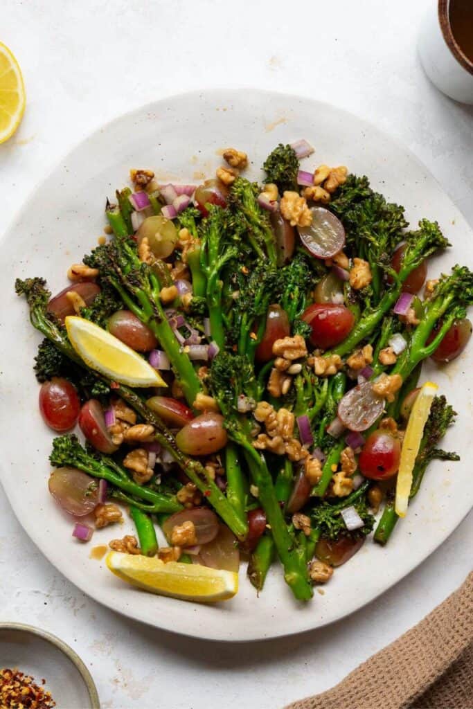 warm broccolini salad with grapes, walnuts, onion, and fresh lemon