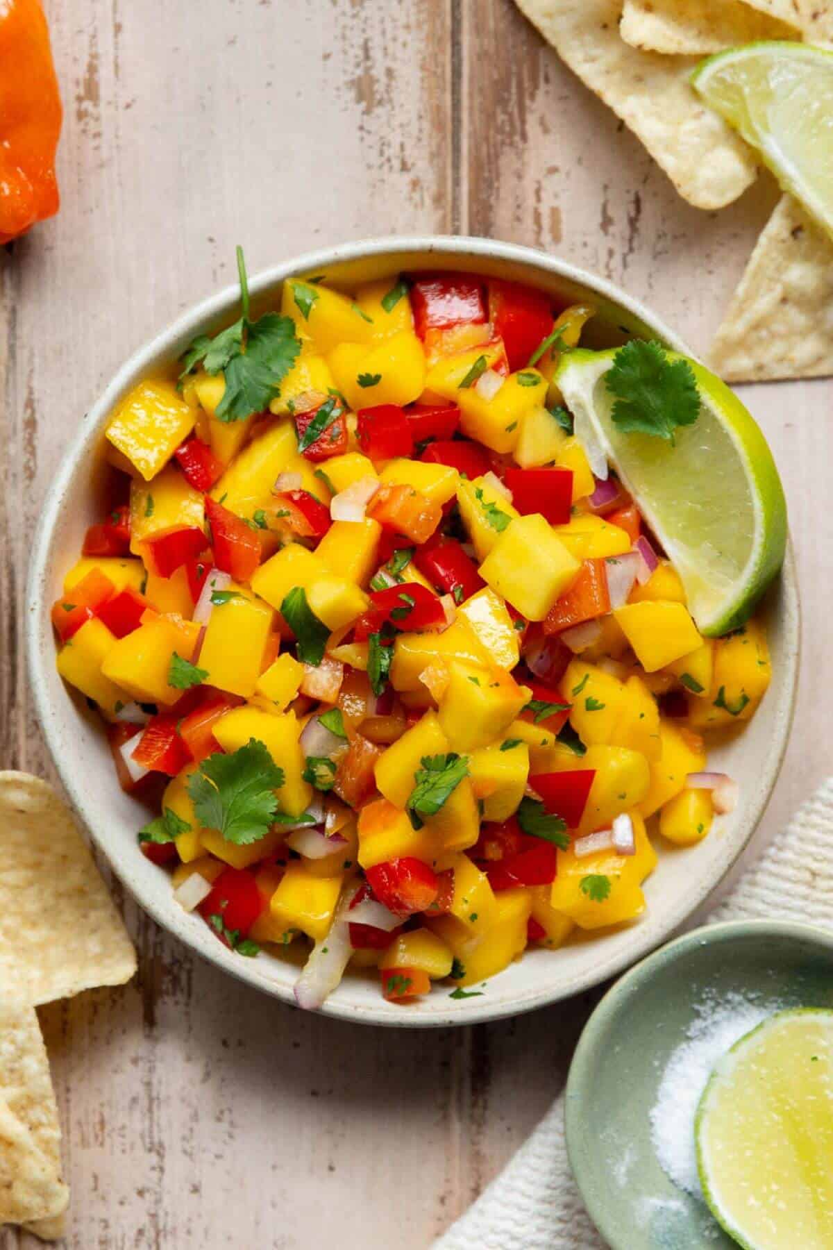 Fresh mango habanero salsa topped with cilantro and lime.