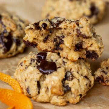 Orange chocolate chip oatmeal cookies with chocolate chunks and made with almond flour.