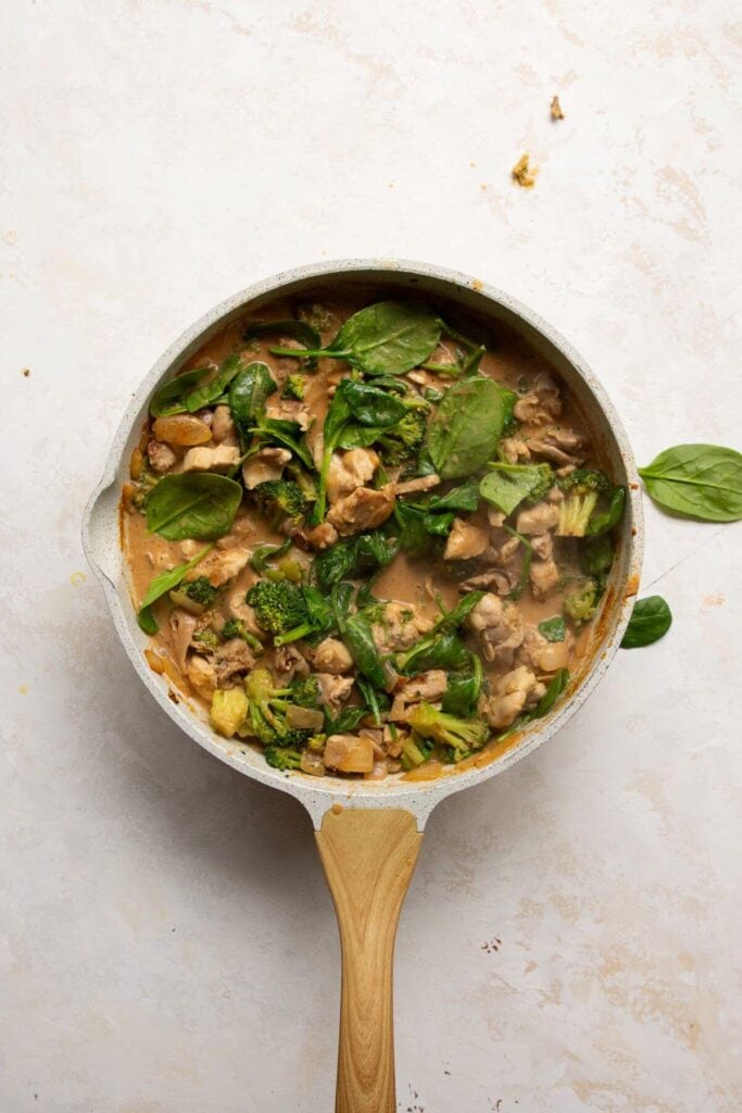stirring in cilantro and baby spinach, then simmer for another 5 minutes