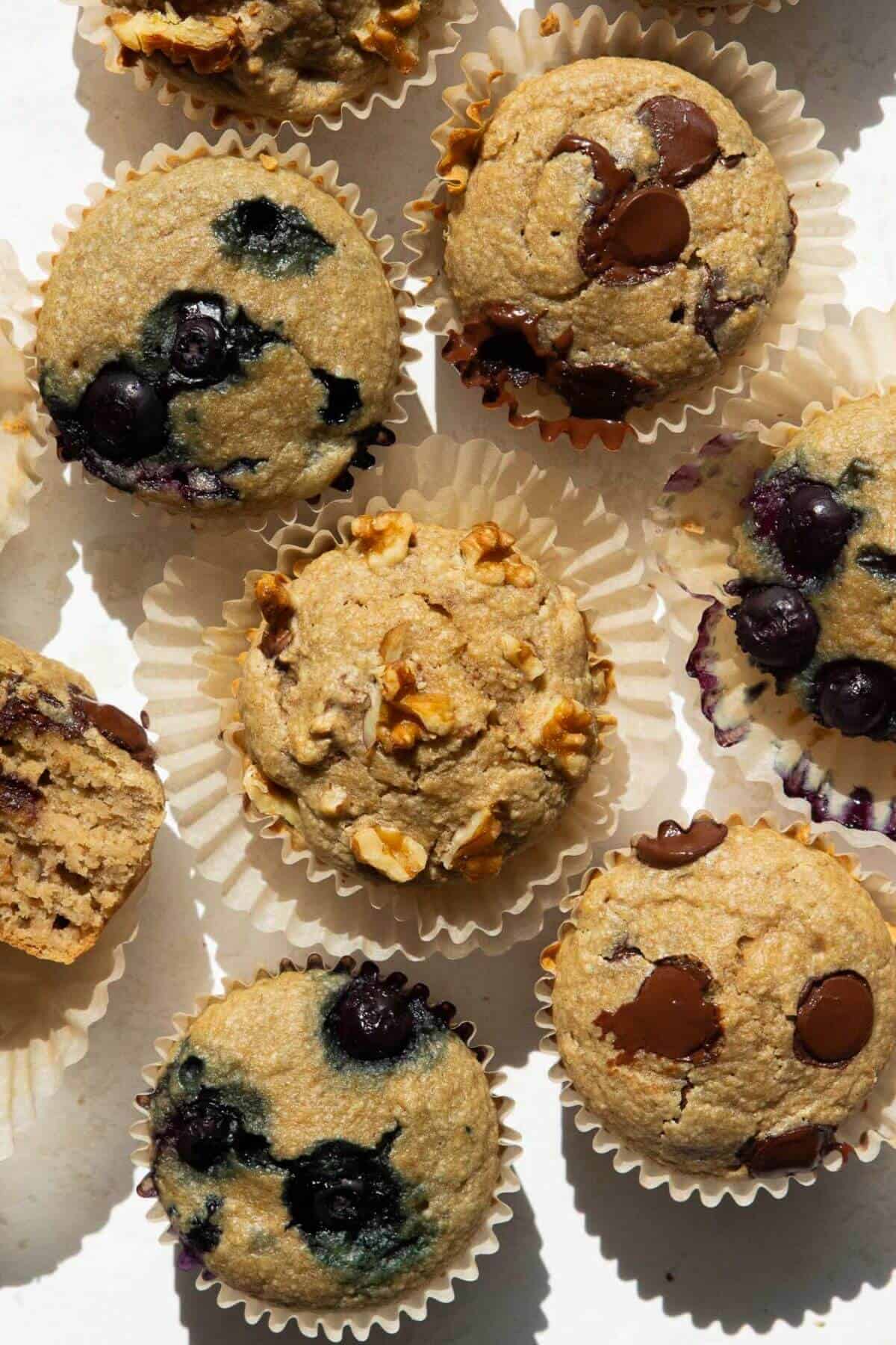banana oatmeal blender muffins with blueberries, walnuts, and chocolate chips