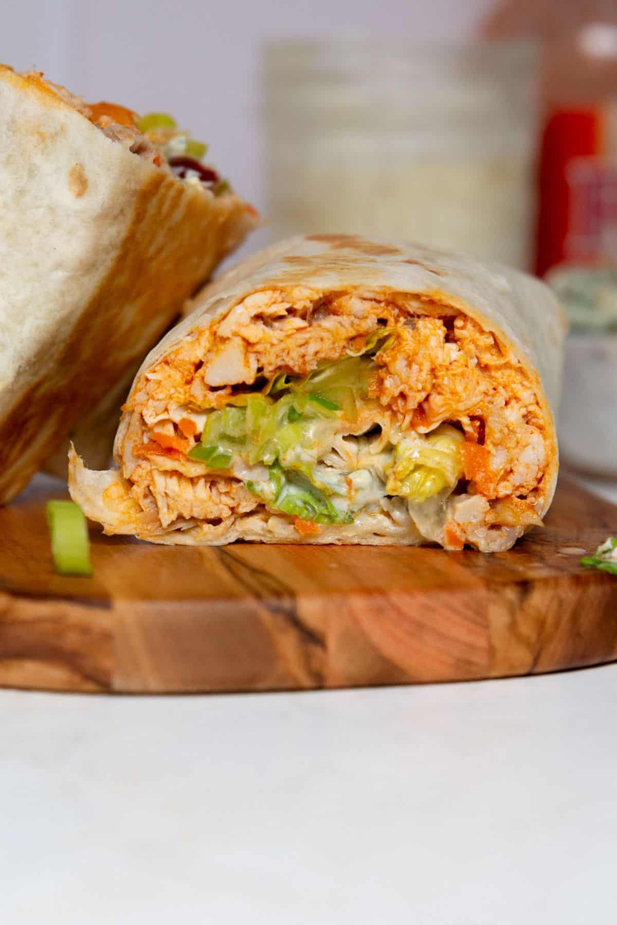 Saucy and high-protein healthy buffalo chicken Caesar wrap.