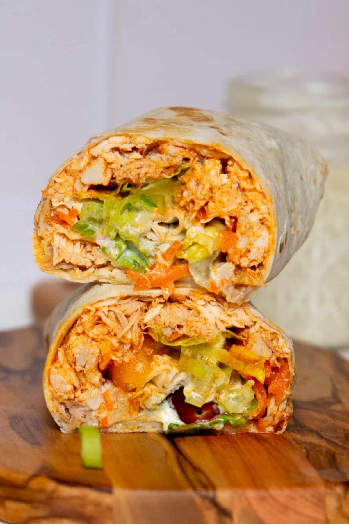 High-protein, healthy buffalo chicken wrap with Greek yogurt Caesar dressing.