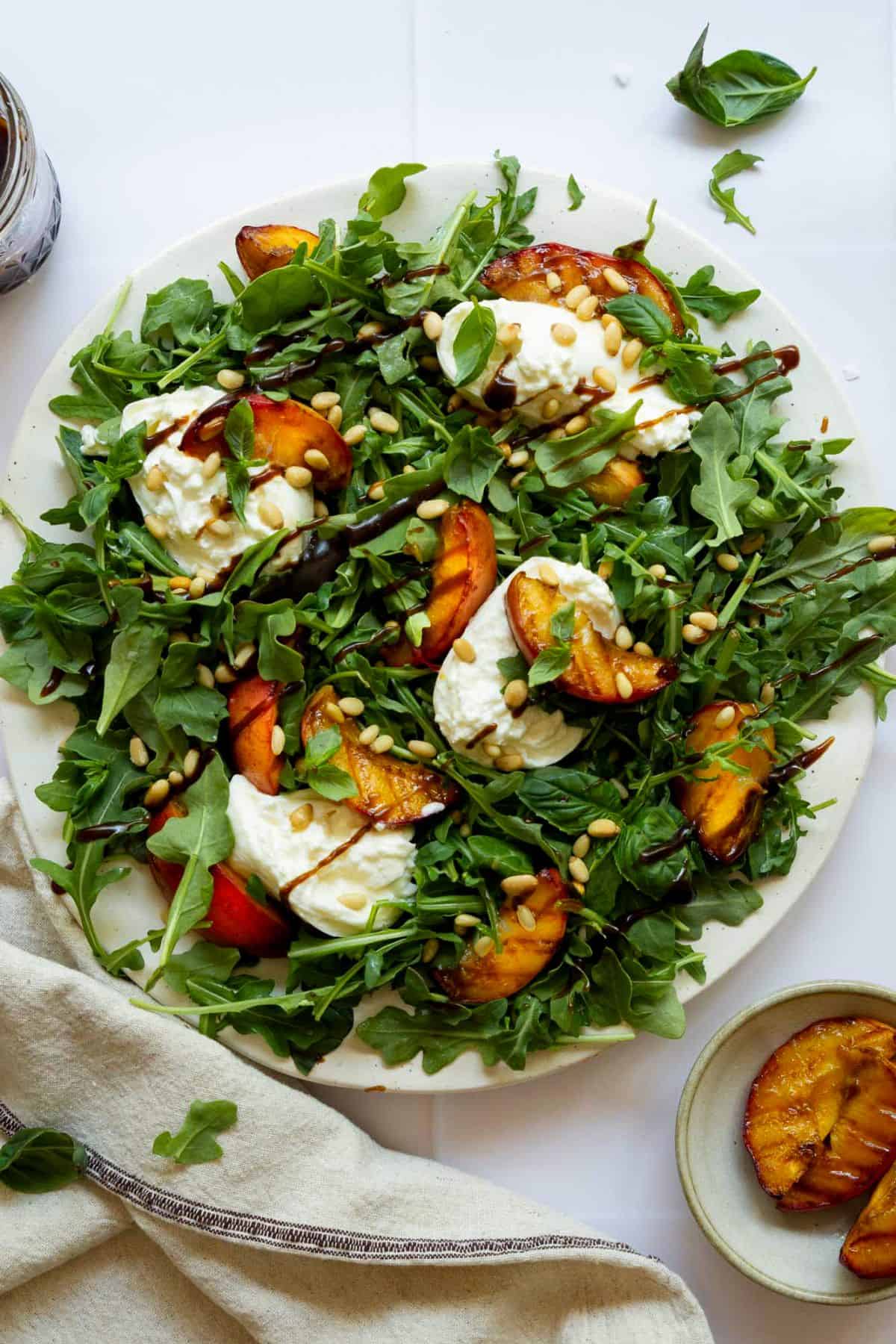 Grilled peach and burrata salad with balsamic vinaigrette