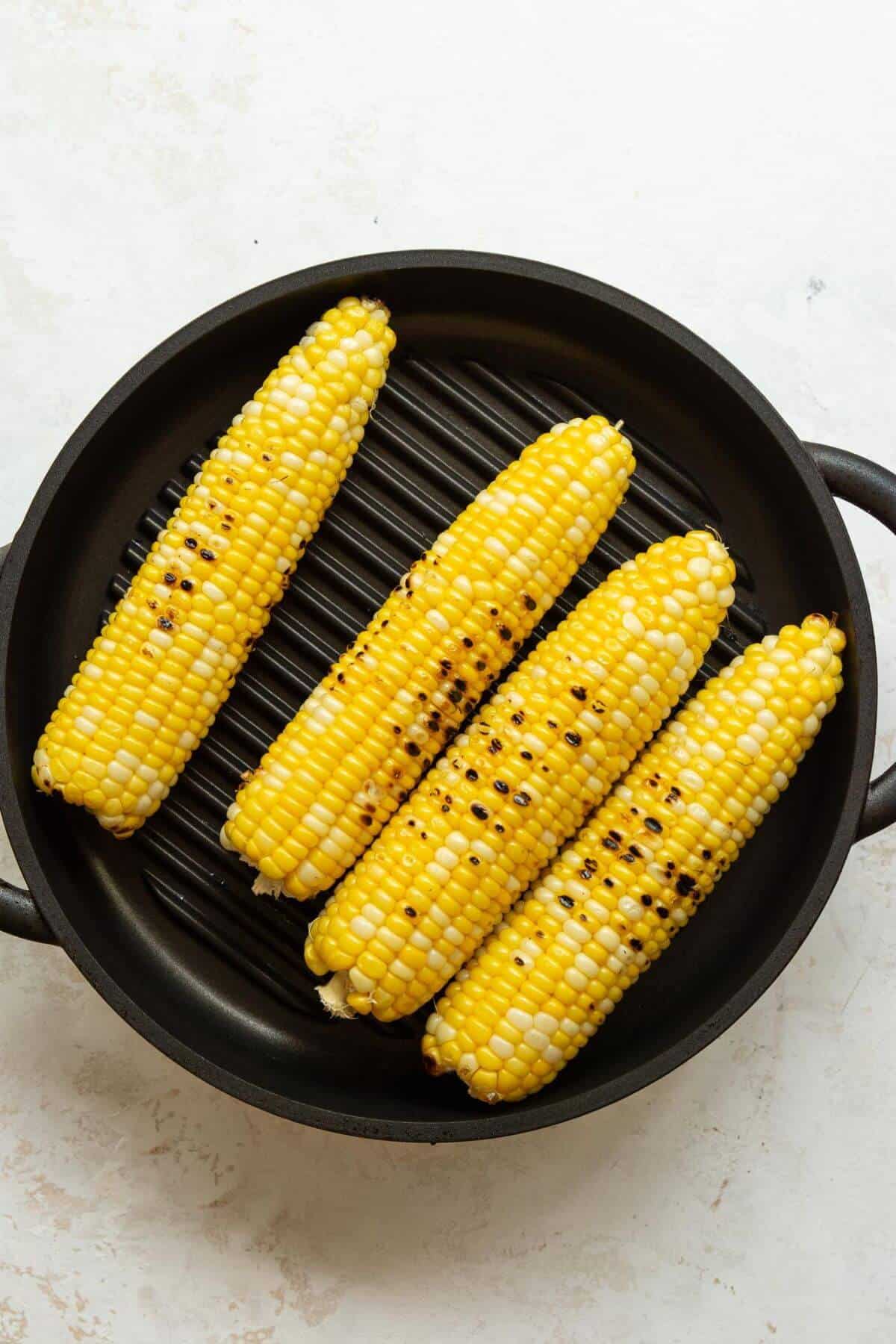 Corn on the grill with light char marks.