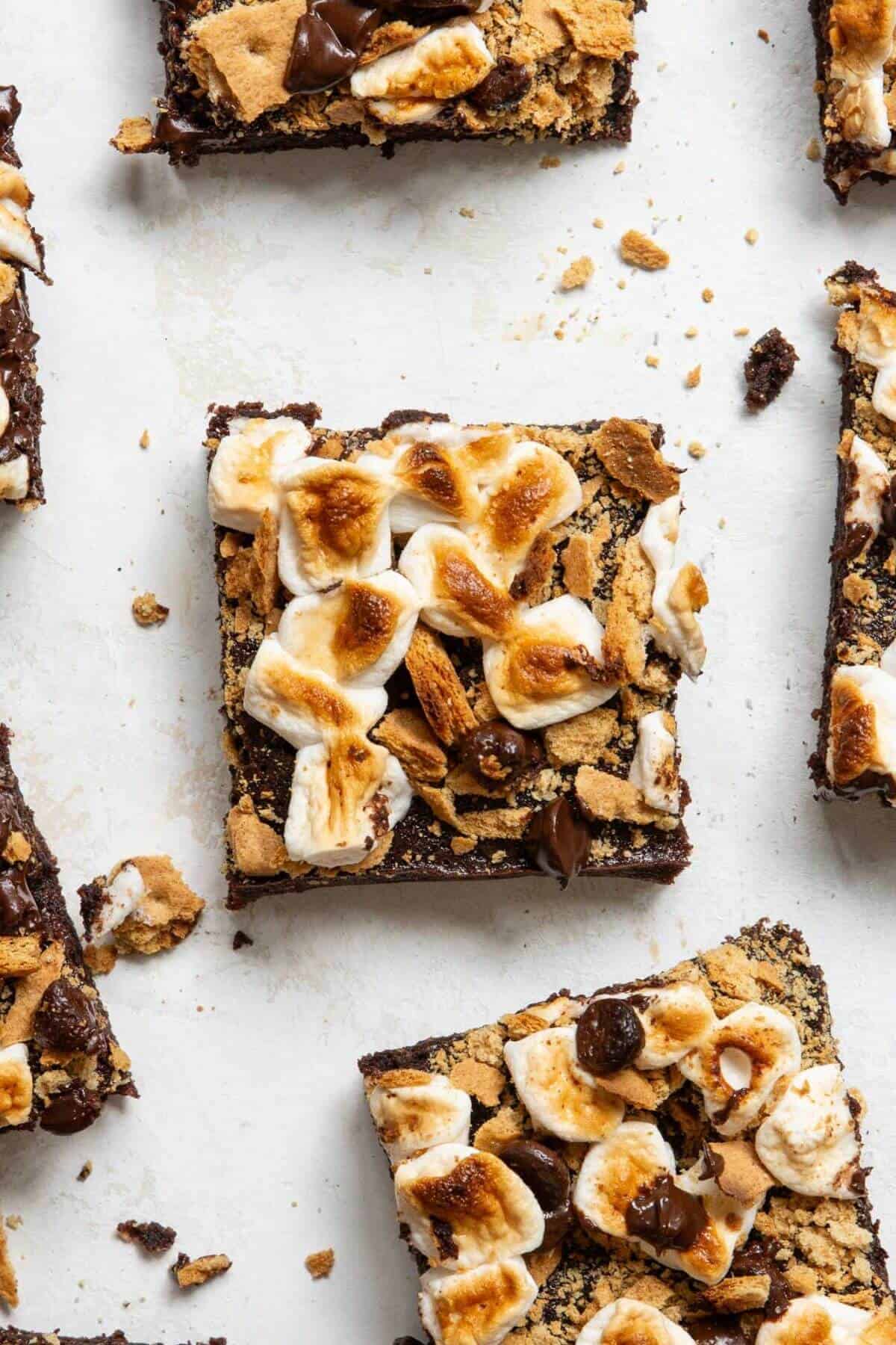 Fudgy healthy s'mores brownies topped with toasted marshmallows and crumbled graham crackers.