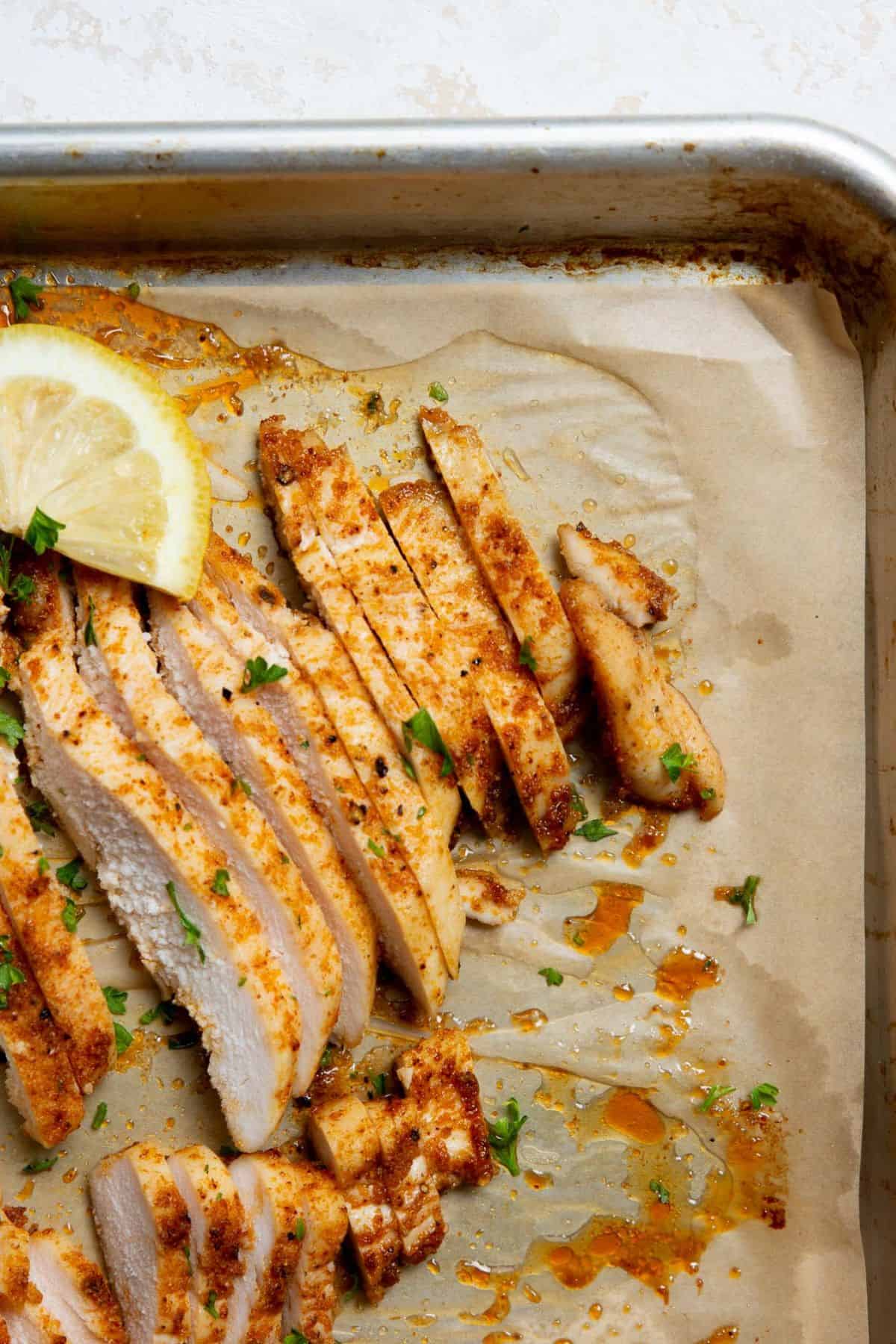 Strips of juicy oven baked thin sliced chicken breast.