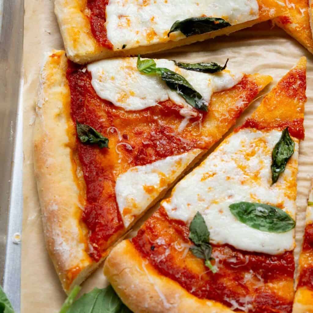 Homemade margherita pizza made with soft, doughy, and high-protein Greek Yogurt Pizza Dough.
