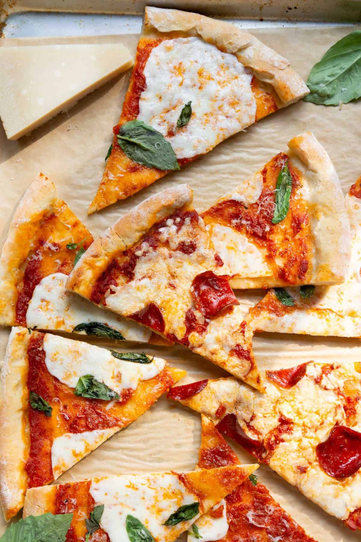 Pizza slices with homemade 2 ingredient Greek yogurt pizza dough crust.