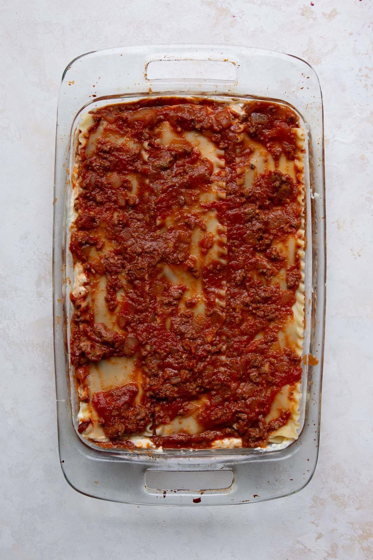 Third layer of meat sauce on top of the noodles and cottage cheese.