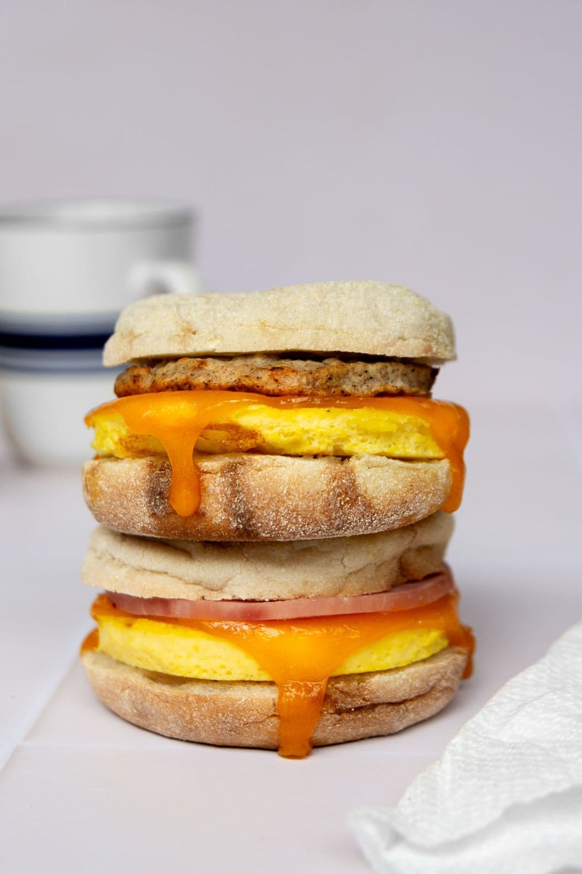 High-protein breakfast sandwich with egg, cheddar cheese, and chicken sausage on an English muffin.
