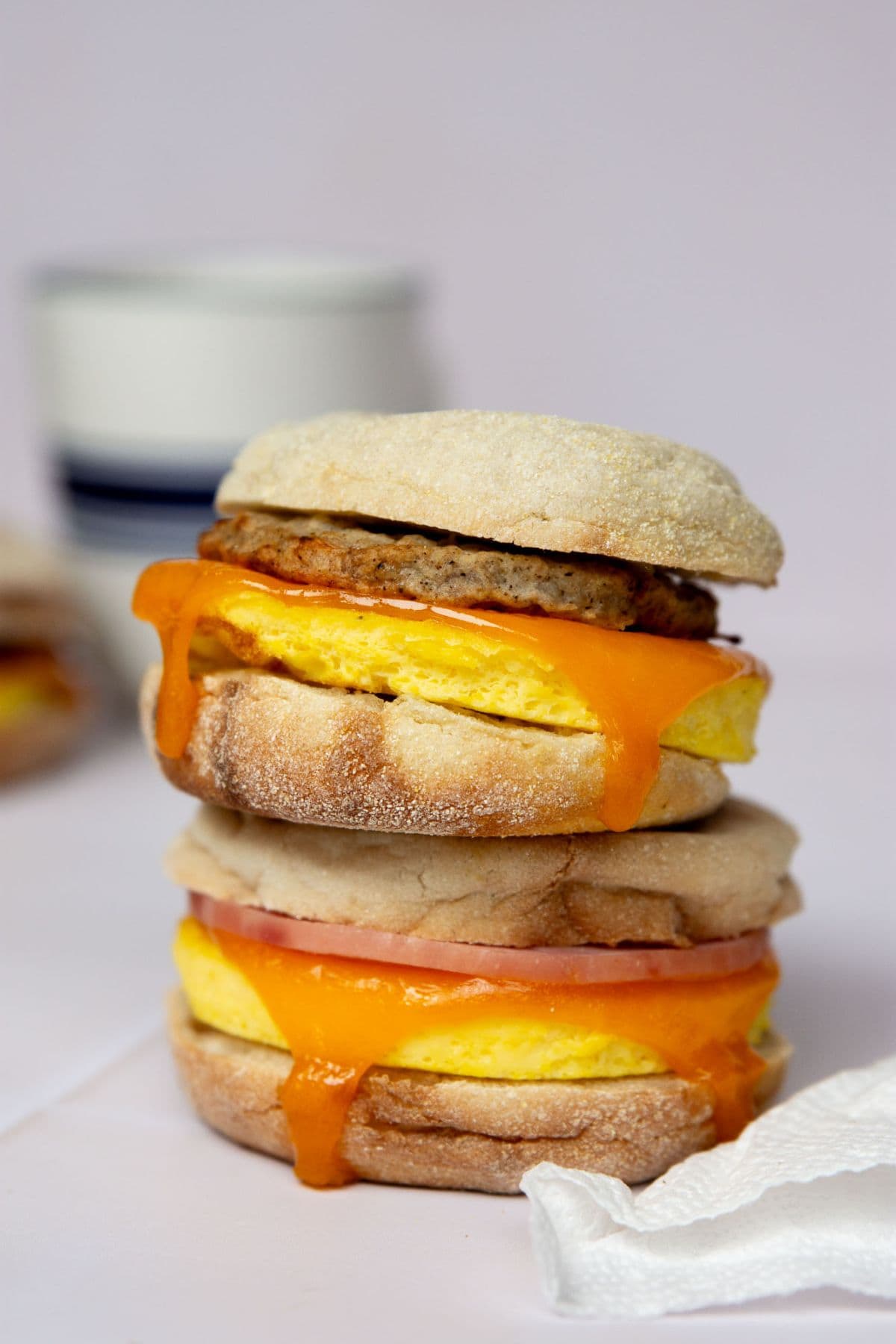 High-protein freezer breakfast sandwich with fluffy eggs, cheddar cheese, and sausage on an English muffin.