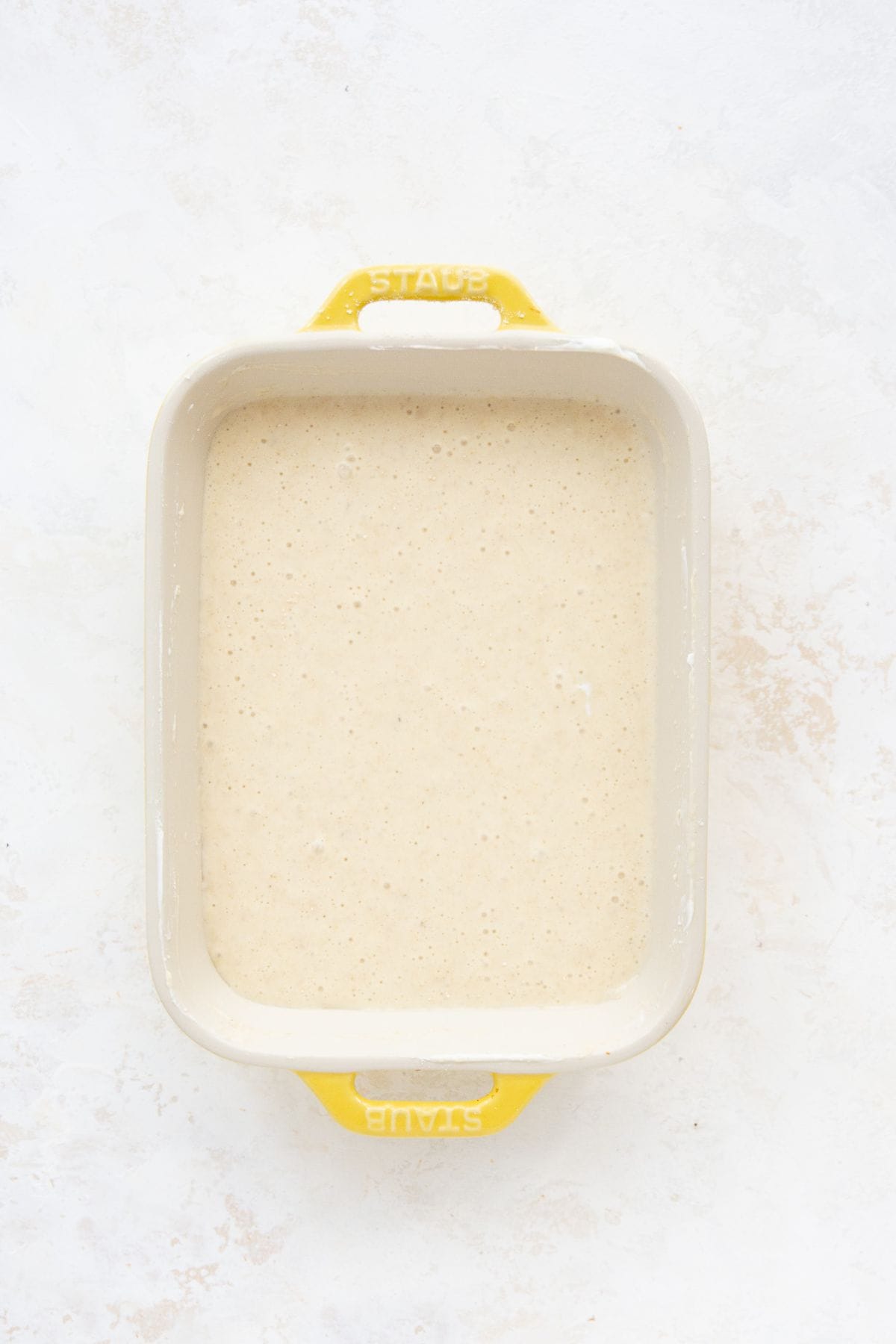 Smooth protein pancake batter in a baking dish.