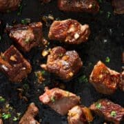Juicy garlic butter steak bites with hot honey and a golden crust.