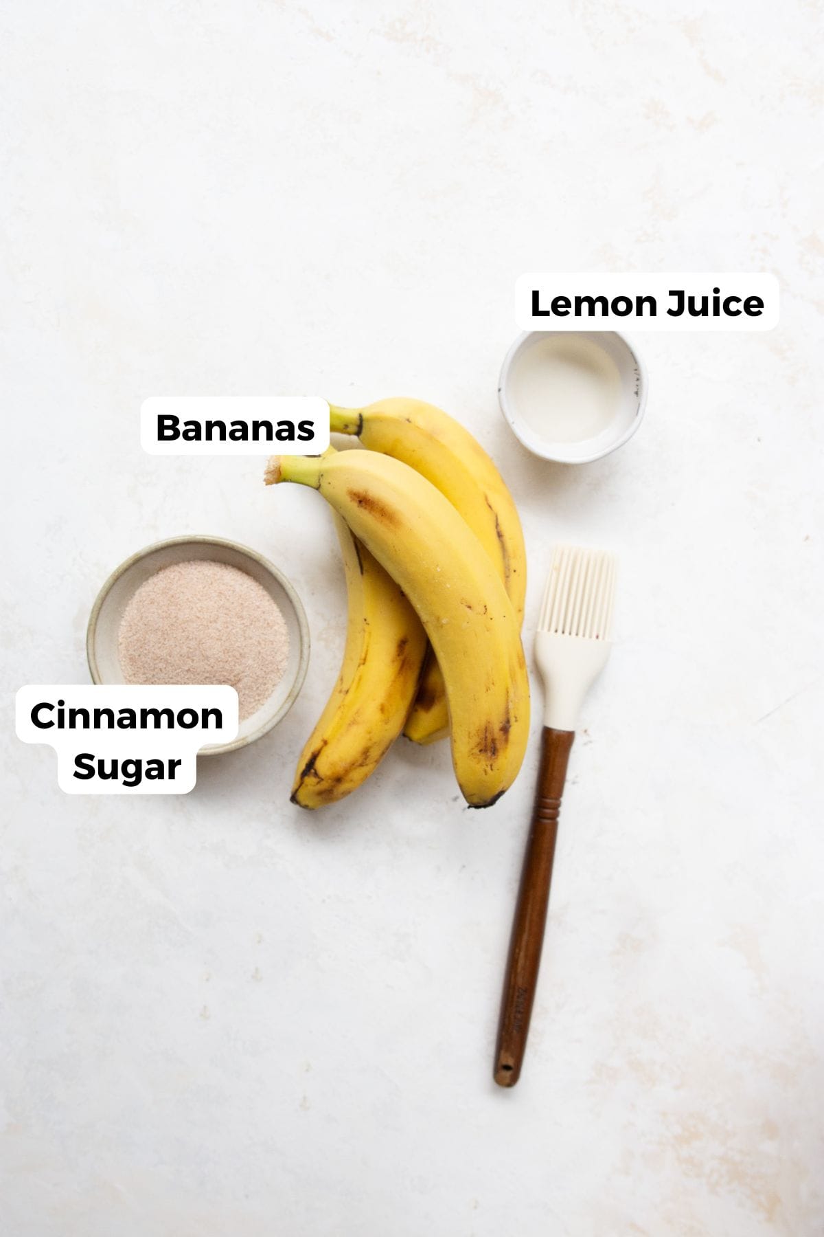 All ingredients in air fryer banana chips, including: bananas, lemon juice, salt, and optional cinnamon sugar.