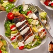 Crispy blackened salmon Caesar salad with healthy yogurt caesar dressing without mayo.