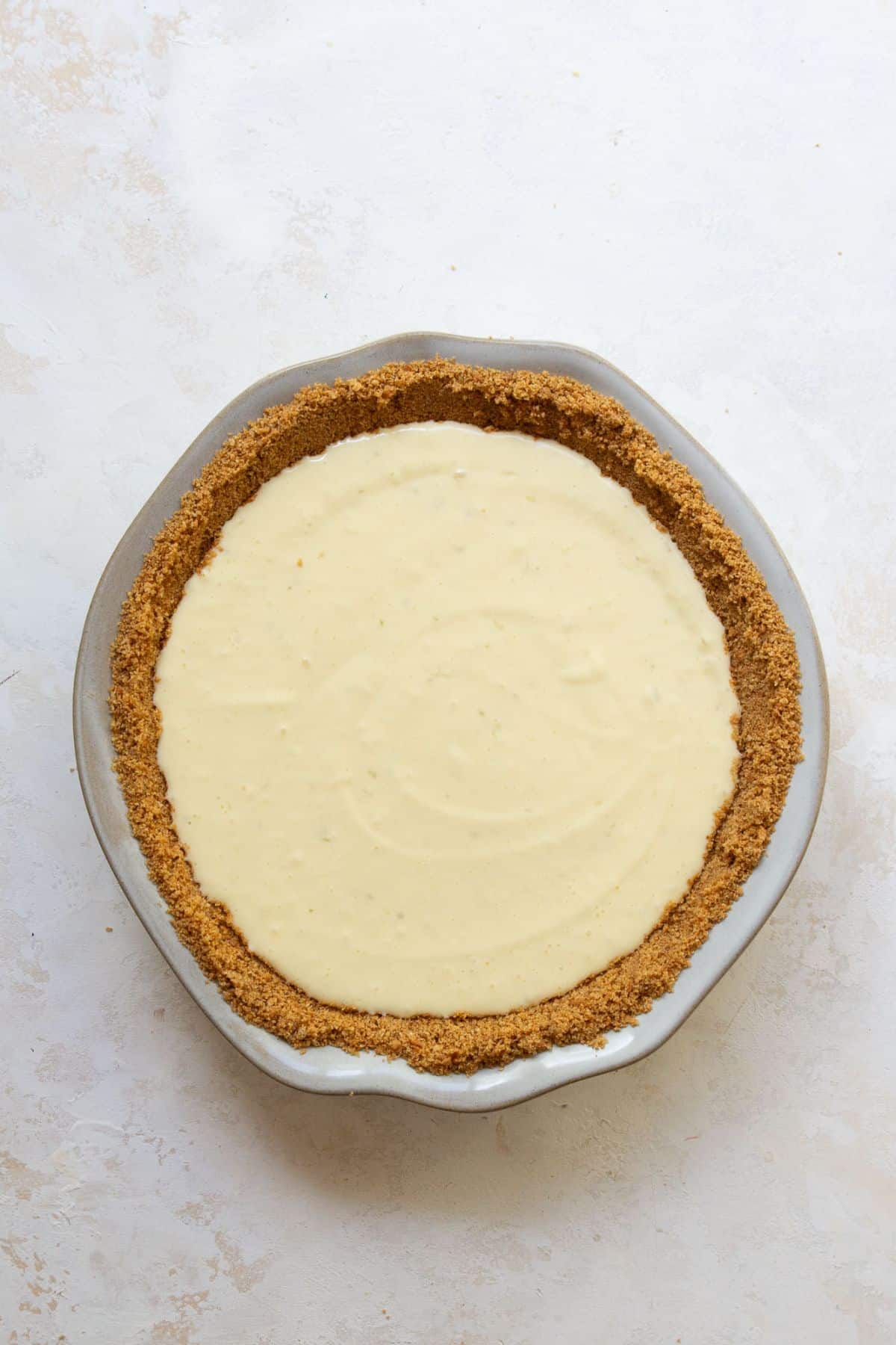 Gluten-free key lime pie ready to bake.