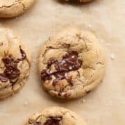 Gooey protein chocolate chip cookies with melty chocolate chips and flaky salt.