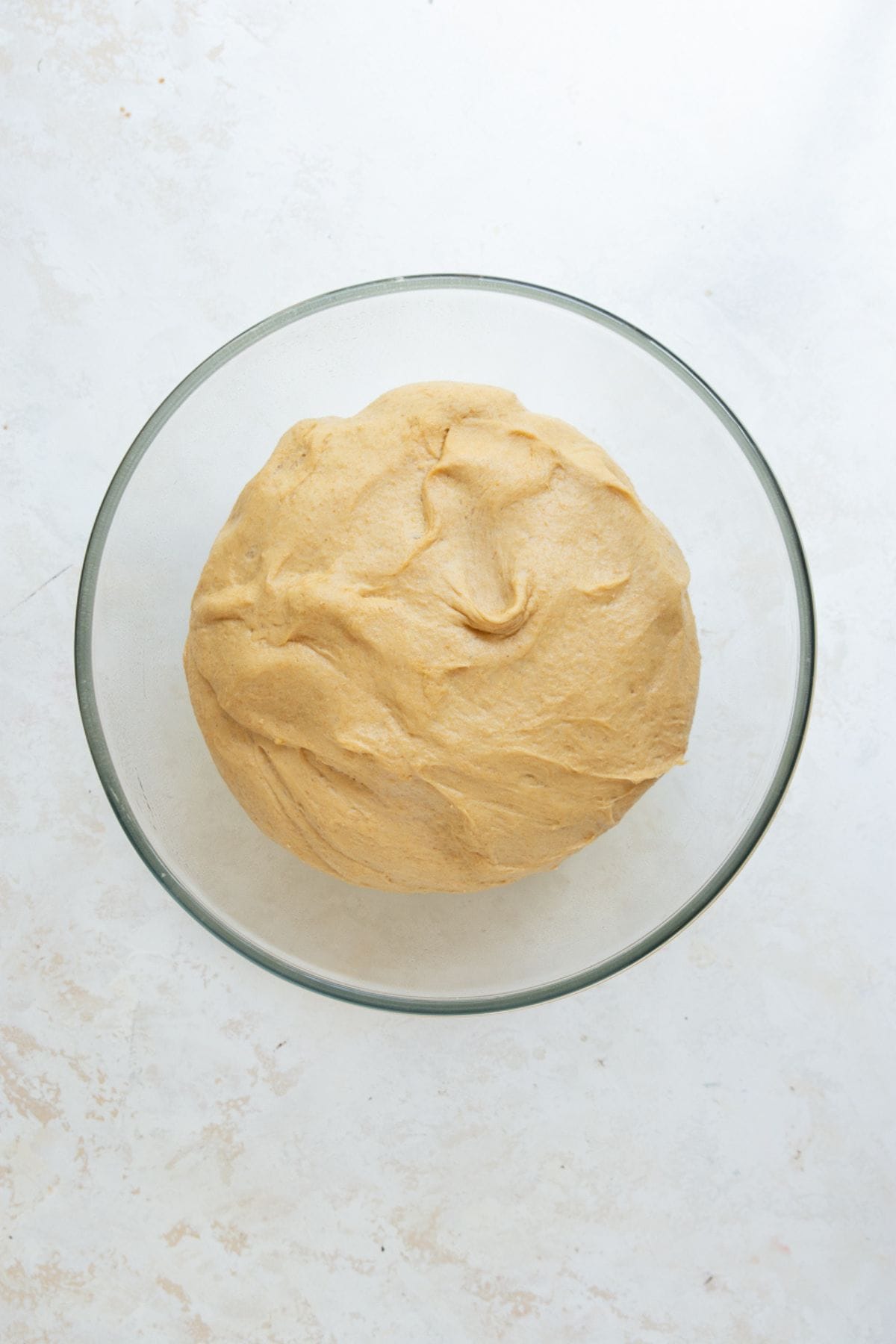 Healthy cinnamon roll dough doubled in size after the first rise.
