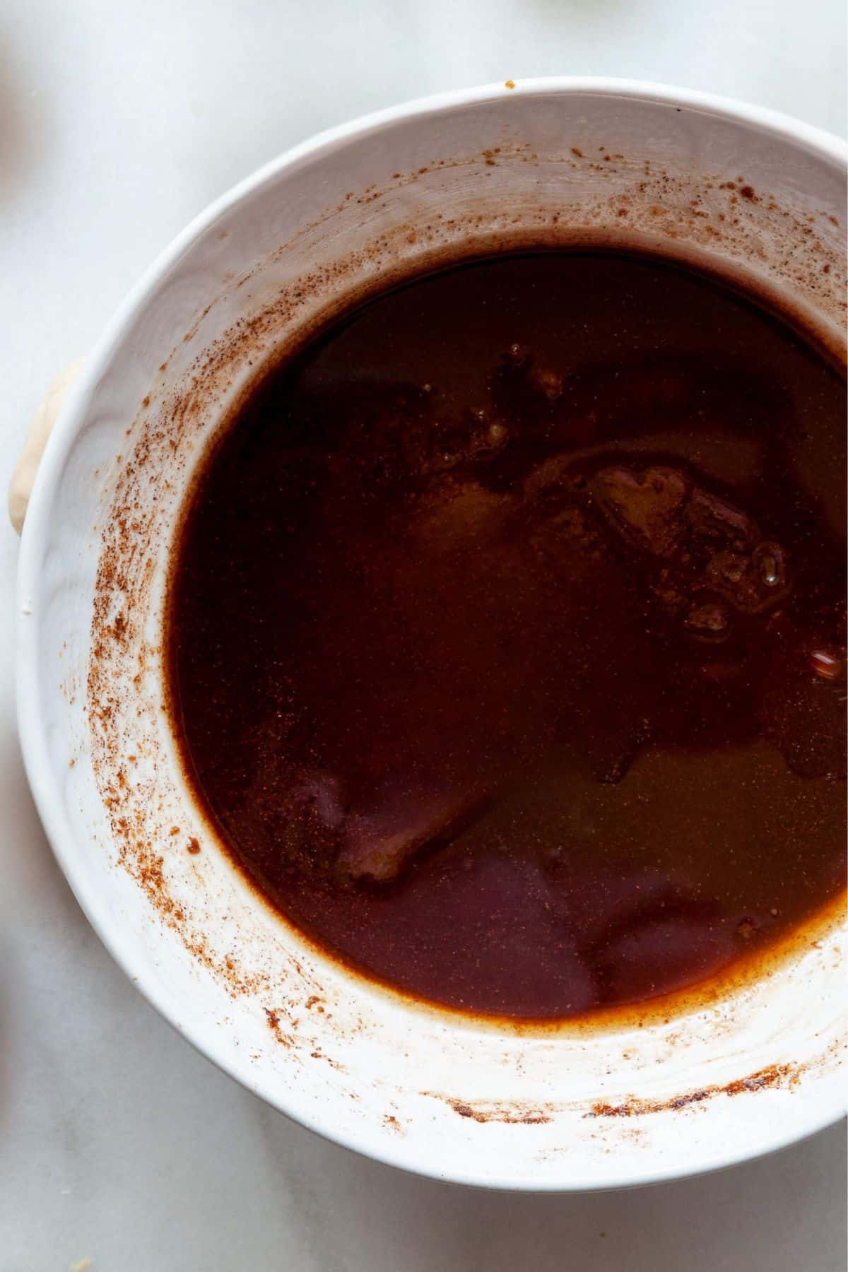 Melted vegan butter, brown sugar, and cinnamon in a bowl.