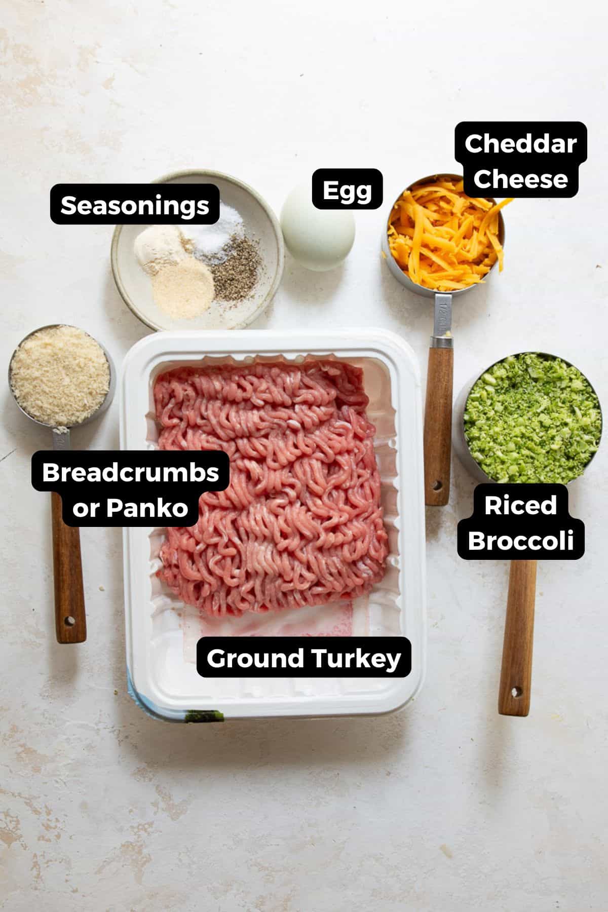 Labeled ingredients for broccoli cheddar turkey meatballs: ground turkey, riced broccoli, cheddar cheese, egg, panko, and seasonings.