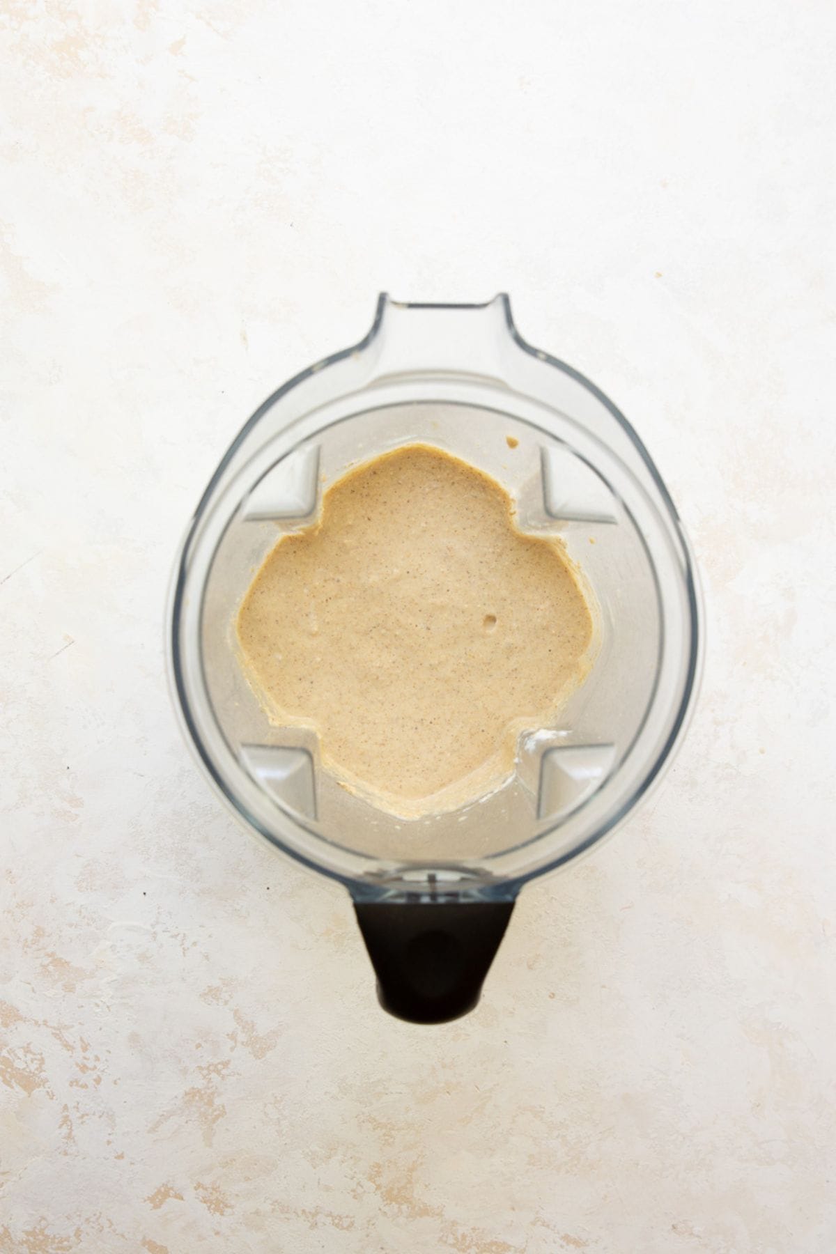Smooth protein oatmeal pancake batter blended in a blender.