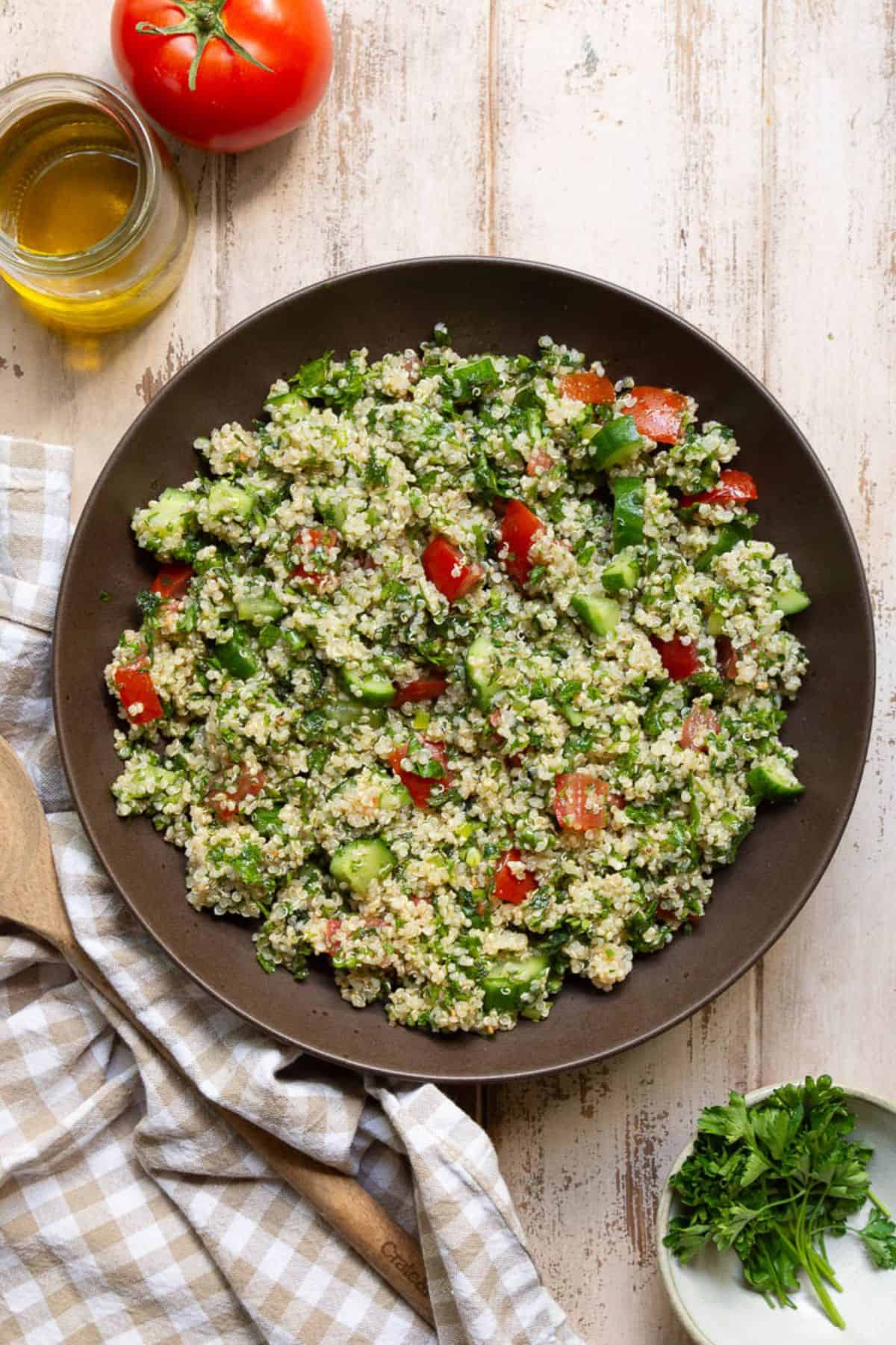 Easy Mediterranean quinoa tabbouleh salad with fresh parsley and olive oil.