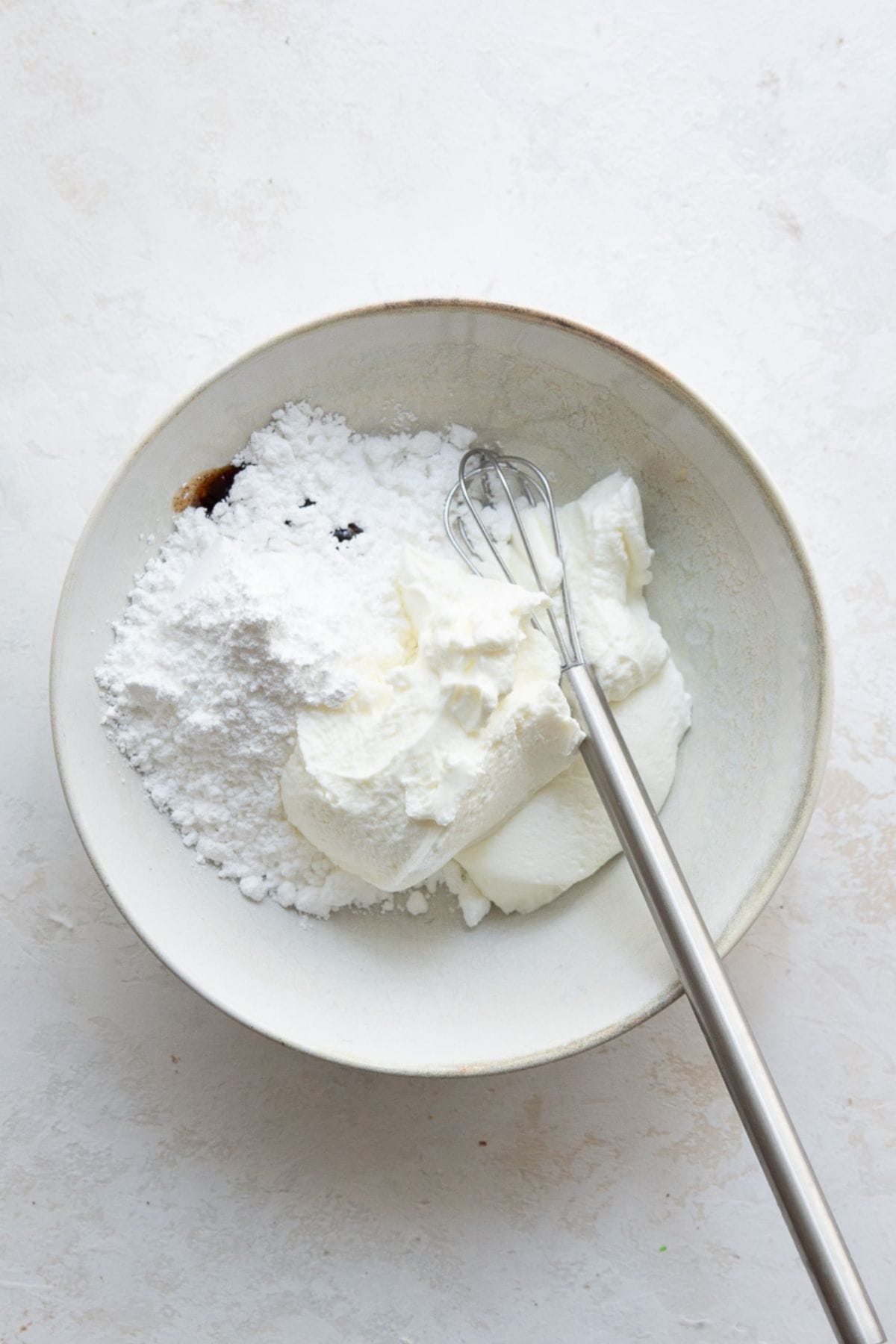 Greek yogurt, powdered sugar, and vanilla whisked together for cake pop frosting.