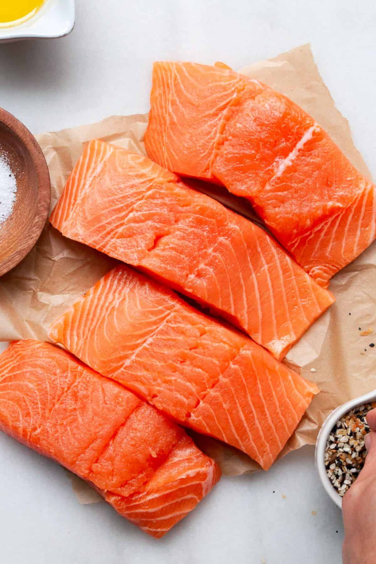 Patting salmon filets dry.