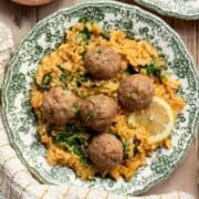 Juicy, gluten-free Greek turkey meatballs served over creamy lemon rice with spinach.
