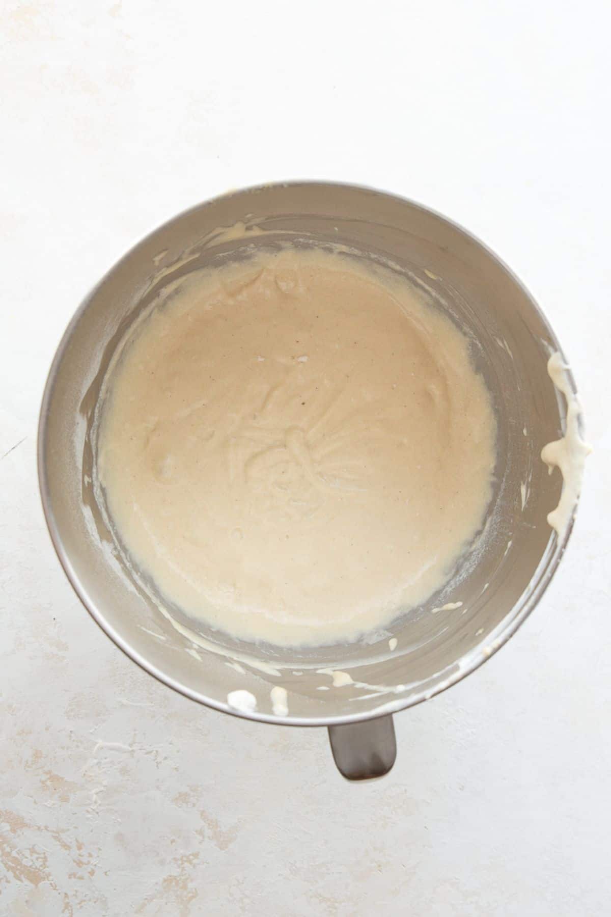 Finished vanilla cupcake batter in a mixing bowl after folding in the Greek yogurt.