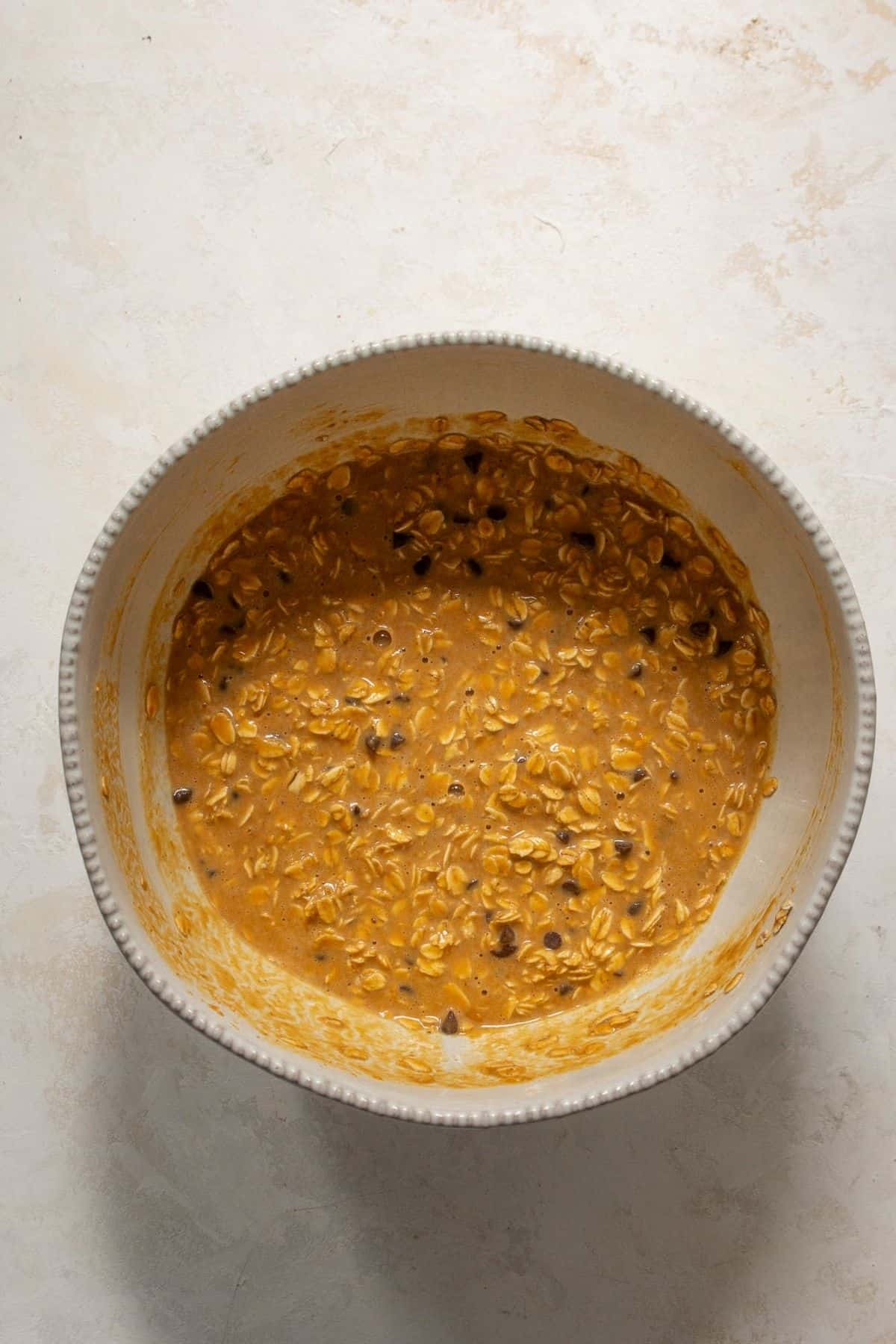 Pumpkin oatmeal batter with chocolate chips and pecans folded in.