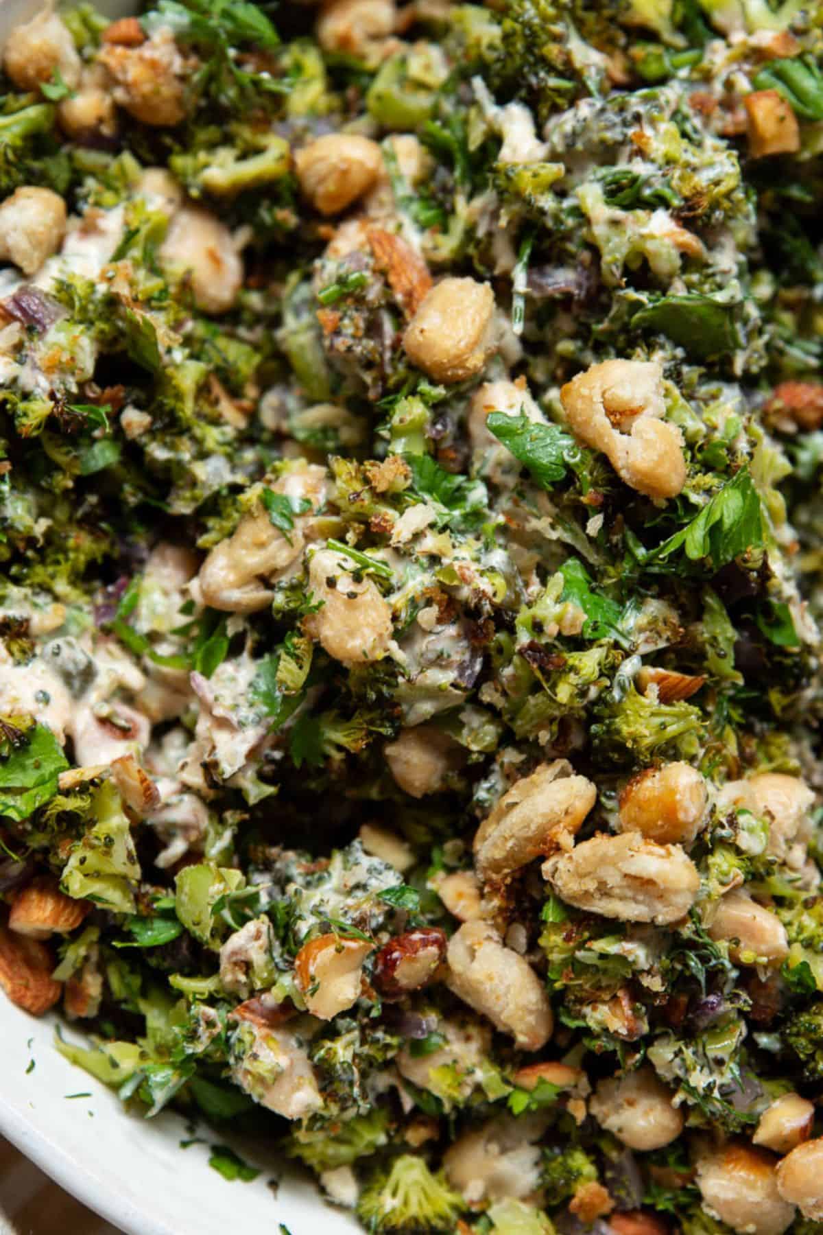 Close-up of herby roasted broccoli salad with crispy white beans and almonds.