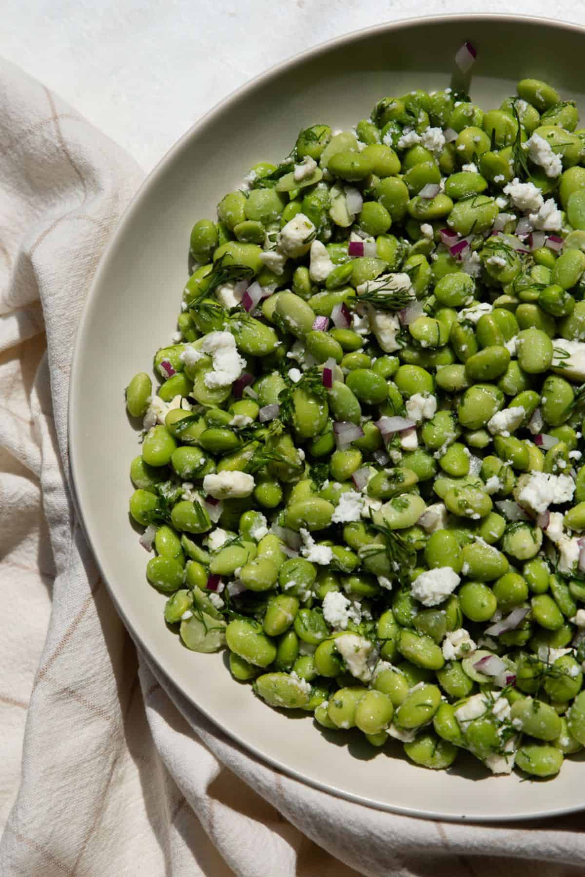 Greek edamame bean salad with feta, dill, and red onion.