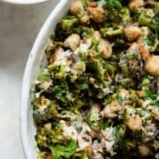 High protein roasted broccoli salad with crispy white beans, almonds, fresh herbs, and lemon yogurt dressing.
